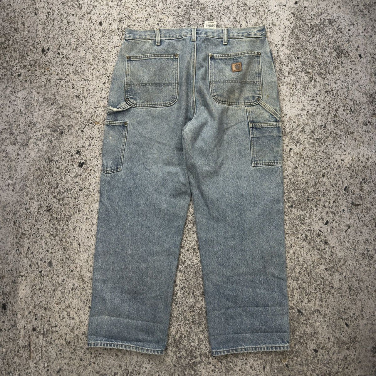 Pantalones vaqueros Carhartt de mezclilla descolorida con doble rodilla de la década de 2000