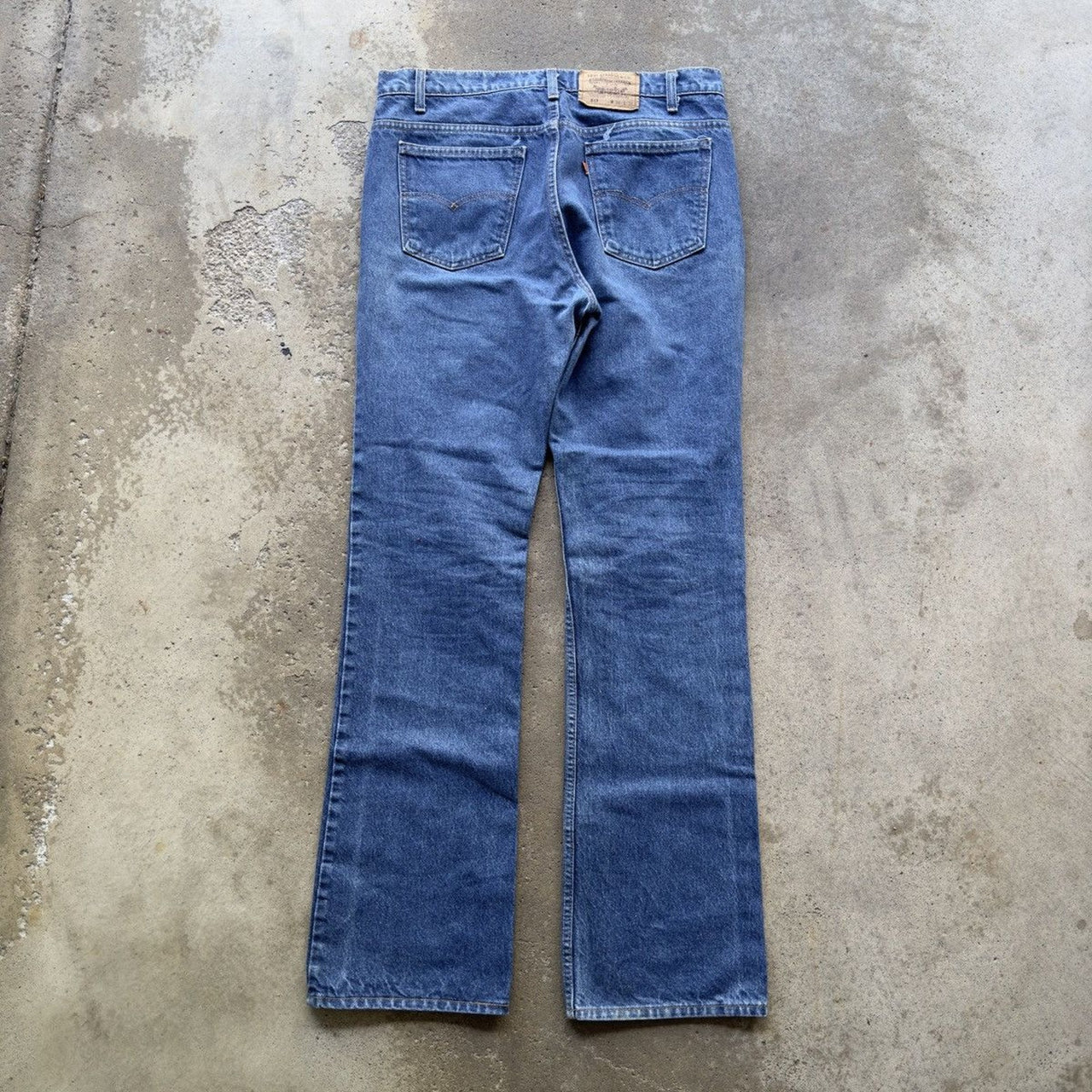 Vaqueros descoloridos con lengüeta naranja Levi's 517 de los años 90
