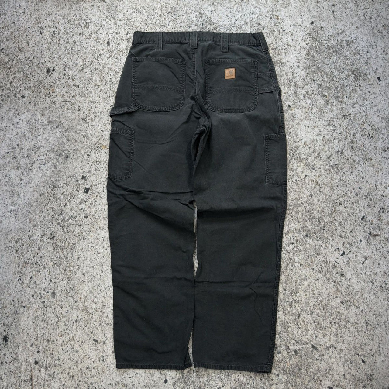 Pantalones de carpintero holgados de lona negra descolorida Carhartt de la década de 2000