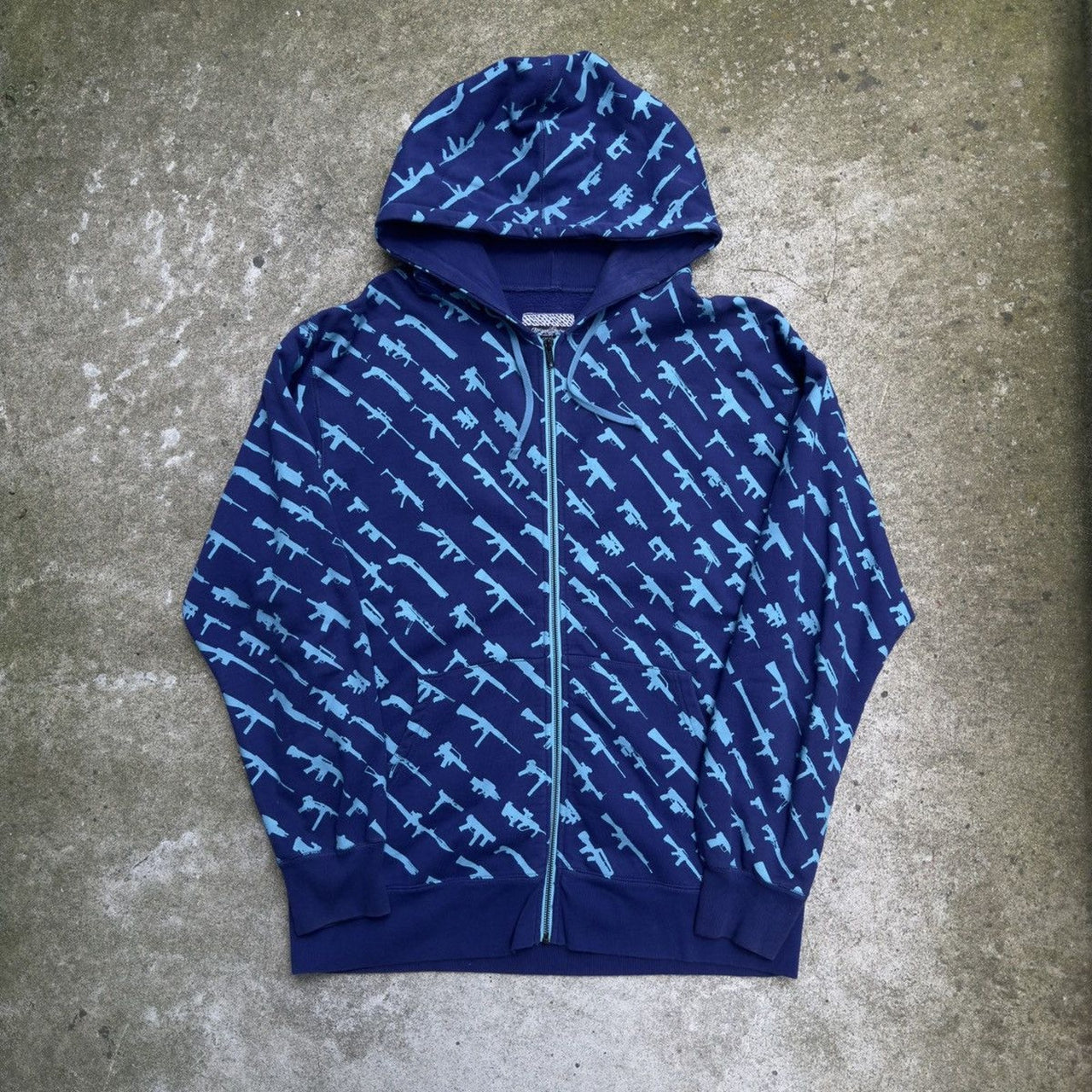 Sudadera con capucha y cremallera azul Rogue Status de la feria de armas de la década de 2010