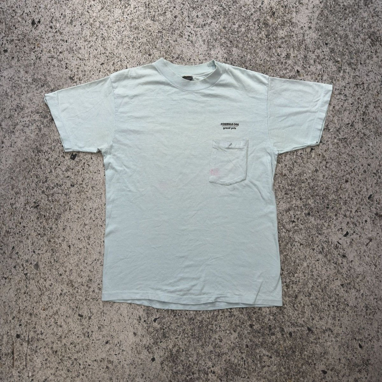 Camiseta de bolsillo de Fórmula 1 descolorida de los años 80