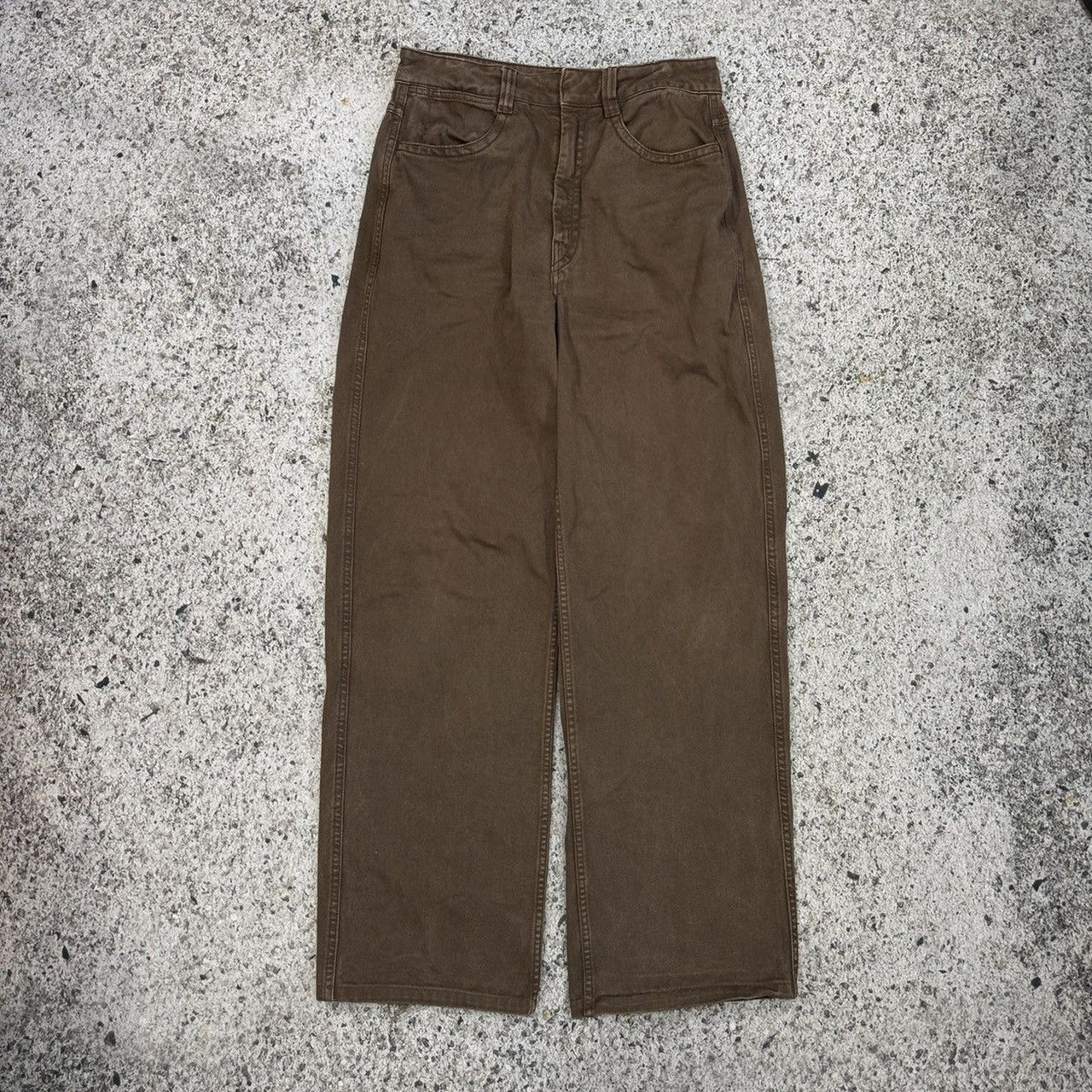 Pantalones Lemaire de cintura alta, pierna ancha y curva