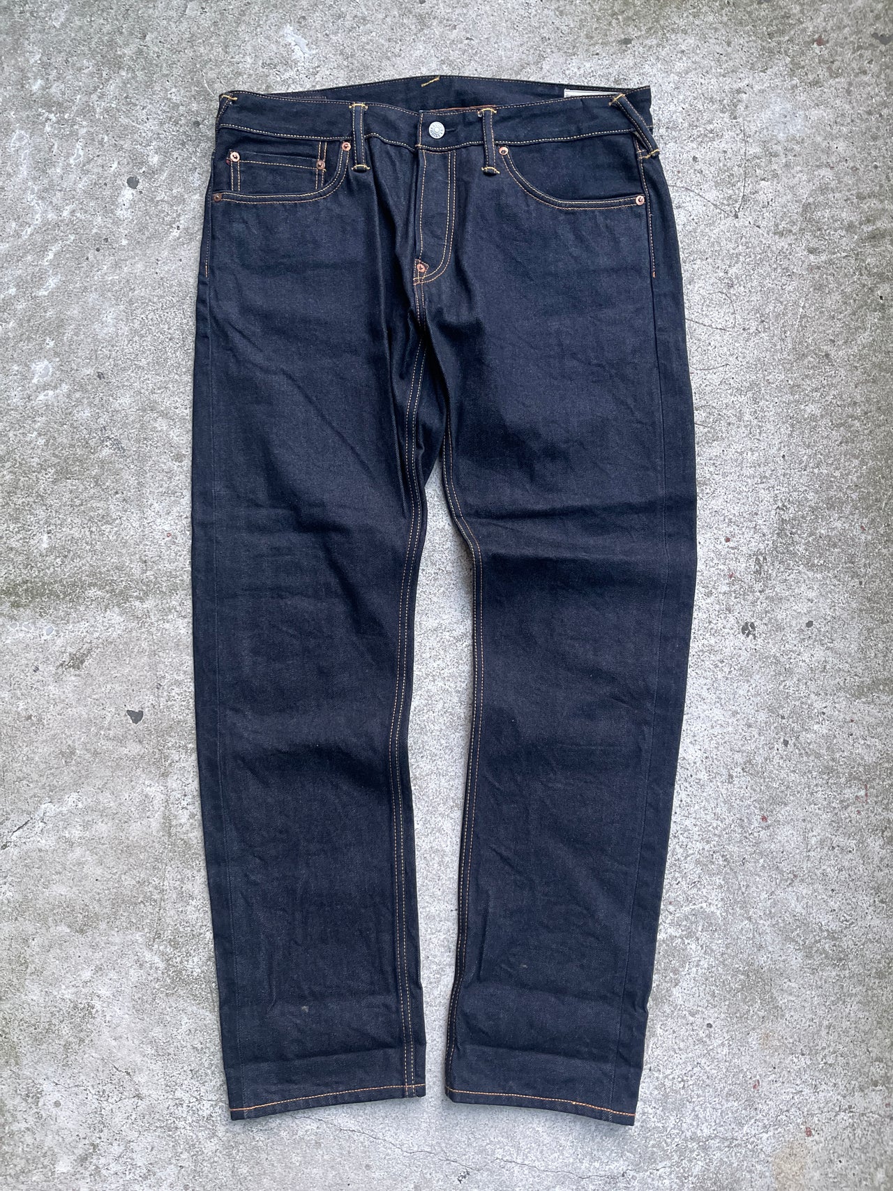 EVISU 2010 MULTI POCKET EMBROIDERED FACES SELVEDGE DENIM JEANS