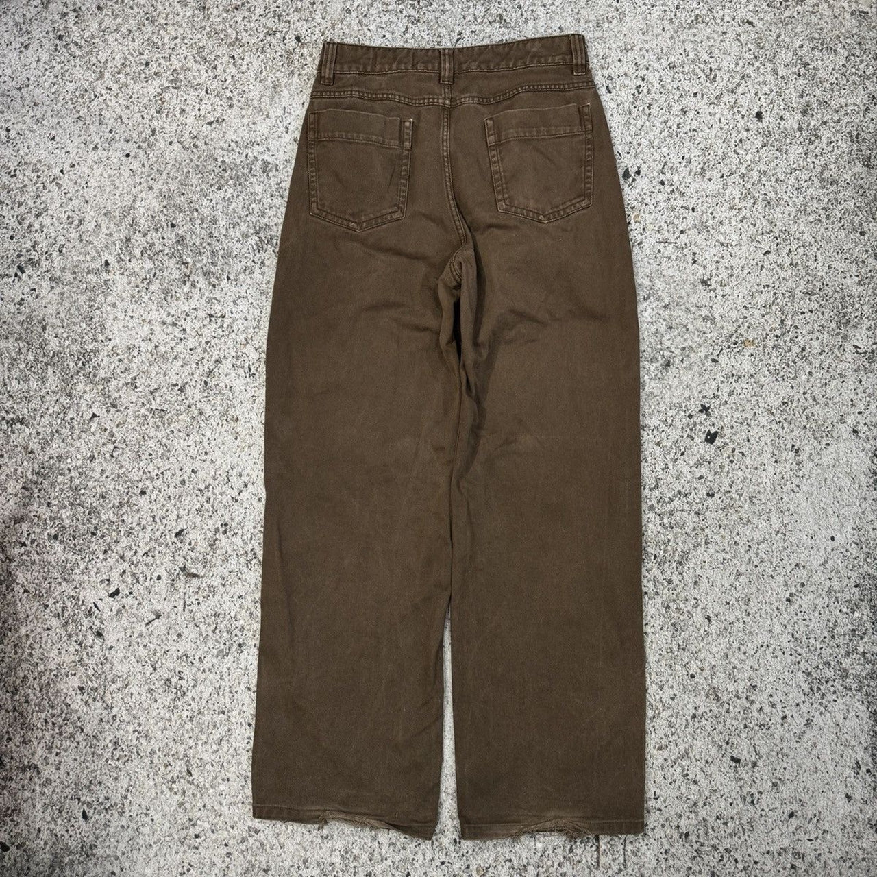 Pantalones Lemaire de cintura alta, pierna ancha y curva