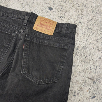 Vaqueros cónicos relajados Levi's 550 Faded Black de los años 90