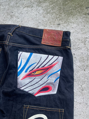 EVISU 2010 MULTI POCKET EMBROIDERED FACES SELVEDGE DENIM JEANS