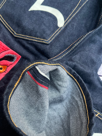EVISU 2010 MULTI POCKET EMBROIDERED FACES SELVEDGE DENIM JEANS