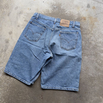 1990s LEVI’S 550 ORANGE TAB LIGHT WASH BAGGY DENIM JEAN SHORTS JORTS