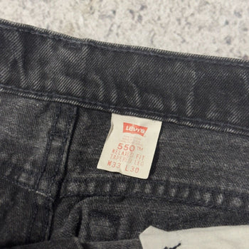 Vaqueros cónicos relajados Levi's 550 Faded Black de los años 90