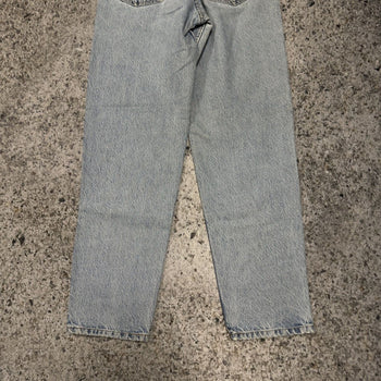 Vaqueros Levi's 550 con lavado claro descolorido y lengüeta naranja de los años 90