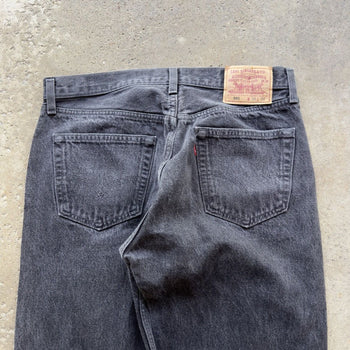 1990s LEVI’S 501 BLACK FADED DENIM JEANS MADE IN USA