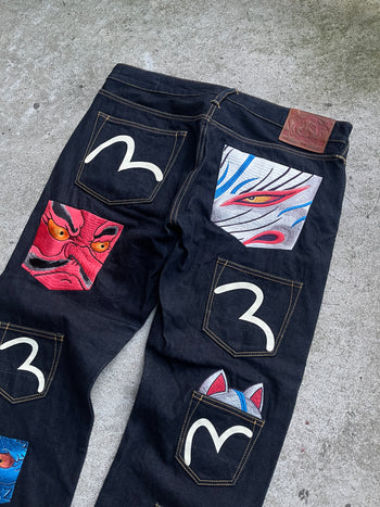 EVISU 2010 MULTI POCKET EMBROIDERED FACES SELVEDGE DENIM JEANS