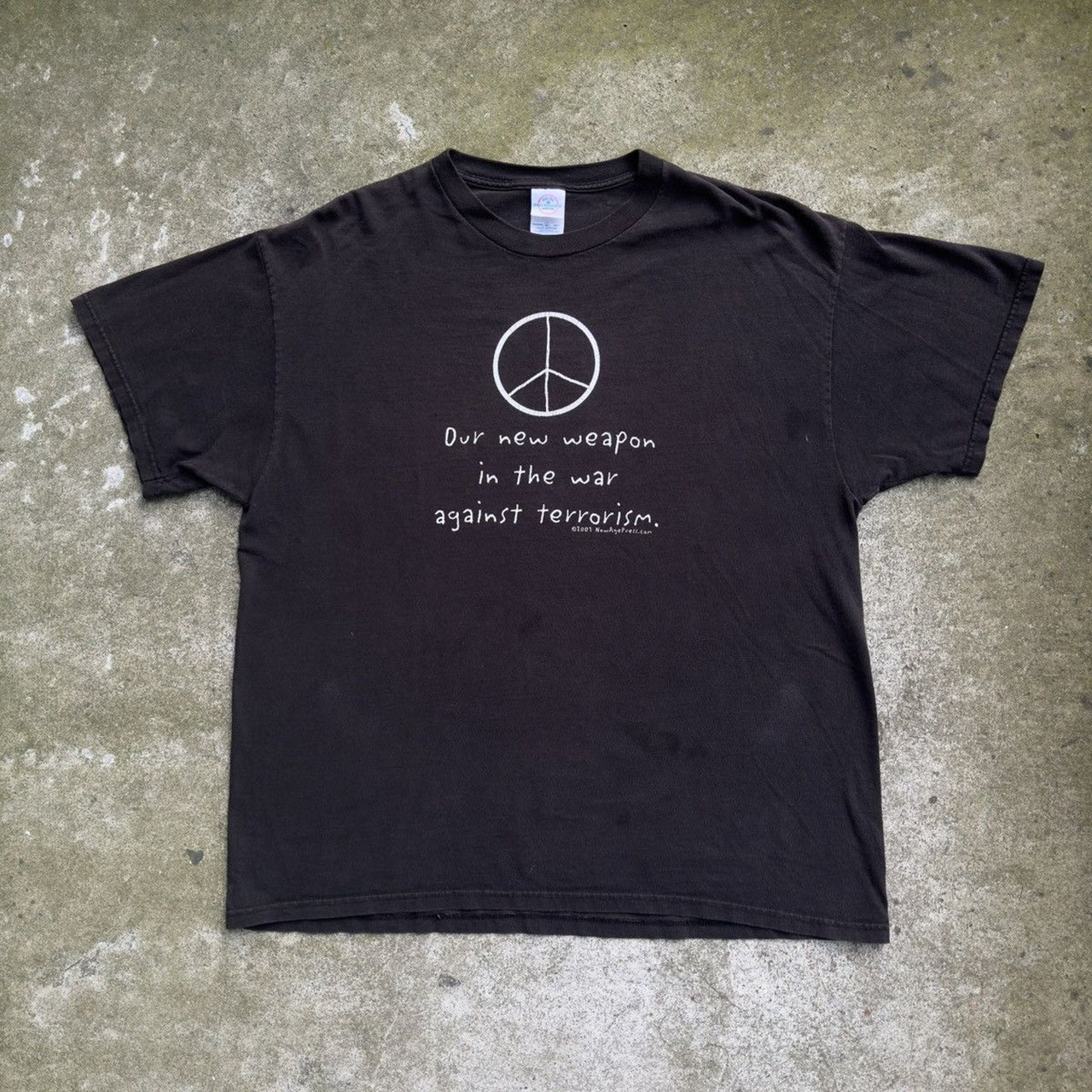 2000S OUR NEW WEAPON IS THE WAR AGAINST TERROISM PEACE TEE