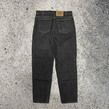 1990s Levi’s 550 Orange Tab Faded Black Denim Jeans