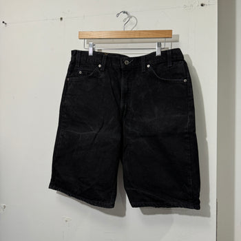 1990S LEVI’S 550 BAGGY BLACK FADED DENIM SHORTS