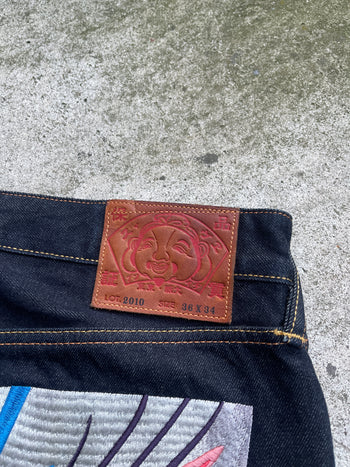 EVISU 2010 MULTI POCKET EMBROIDERED FACES SELVEDGE DENIM JEANS