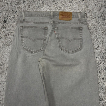 Vaqueros cónicos Levi's 560 de color gris descolorido de los años 90