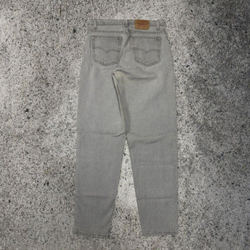 Vaqueros cónicos Levi's 560 de color gris descolorido de los años 90