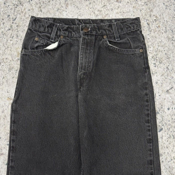 Vaqueros Levi's 550 con lengüeta naranja y negro descolorido de los años 90