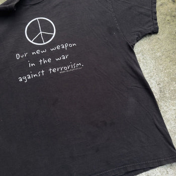 2000S OUR NEW WEAPON IS THE WAR AGAINST TERROISM PEACE TEE