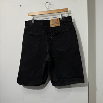 1990S LEVI’S 550 BAGGY BLACK FADED DENIM SHORTS