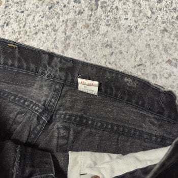 Vaqueros Levi's 560 de corte holgado y cónico en negro descolorido, años 90