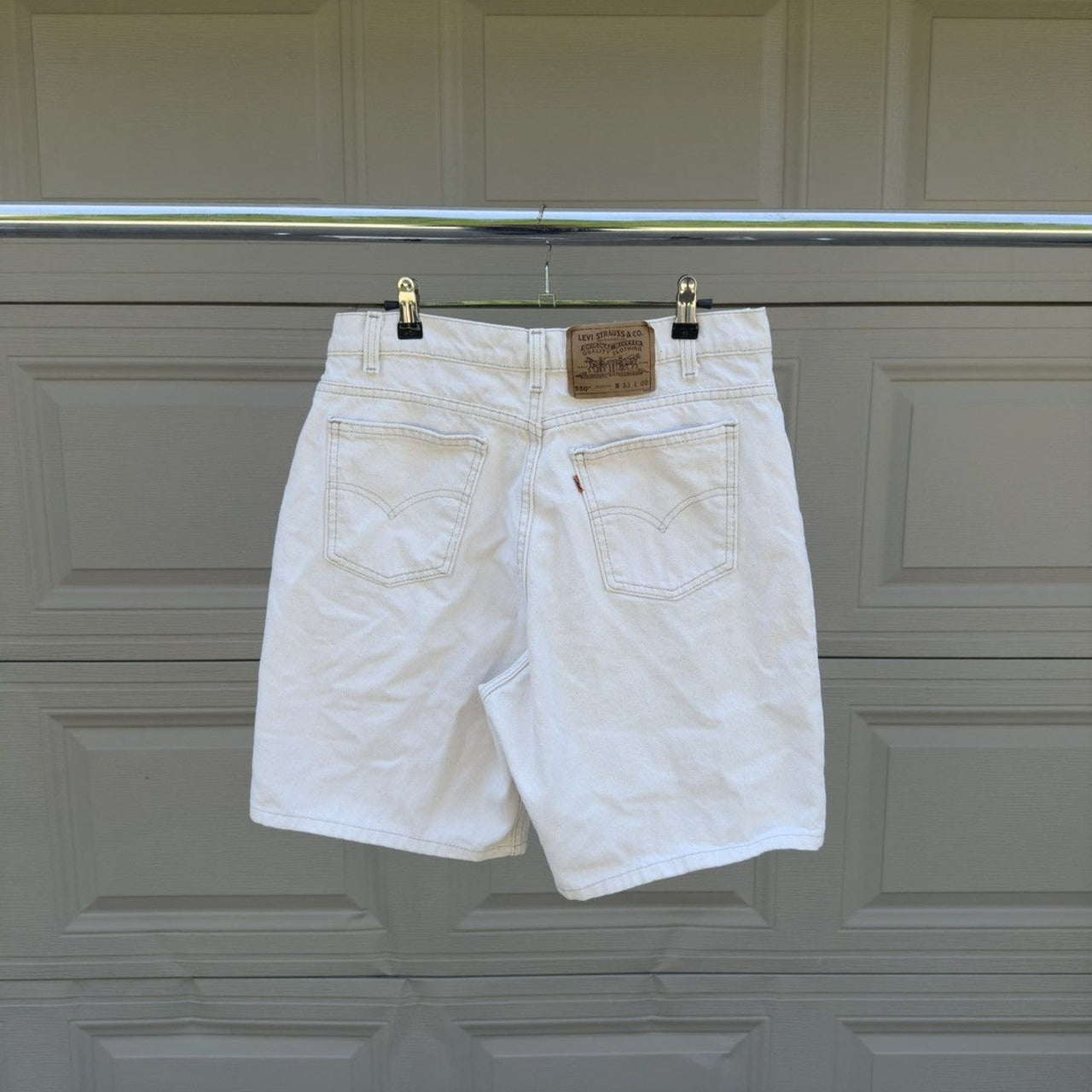 1990s Levi's 550 Orange Tab White Denim Shorts