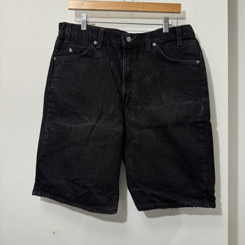 1990S LEVI’S 550 BAGGY BLACK FADED DENIM SHORTS