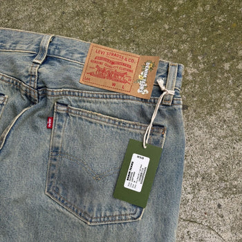 DENIM TEARS LEVI’S 501 DIRTY WASH DENIM JEANS