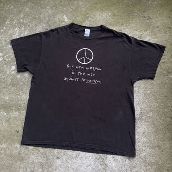 2000S OUR NEW WEAPON IS THE WAR AGAINST TERROISM PEACE TEE