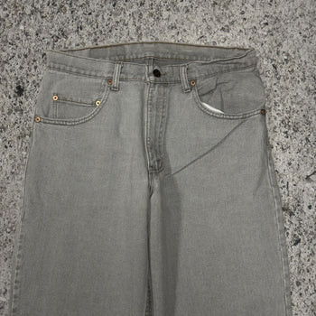 Vaqueros cónicos Levi's 560 de color gris descolorido de los años 90