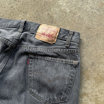 1990s LEVI’S 501 FADED BLACK DENIM JEANS MADE IN USA