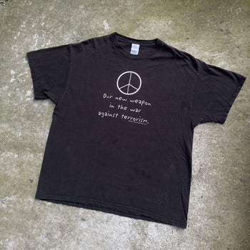 2000S OUR NEW WEAPON IS THE WAR AGAINST TERROISM PEACE TEE