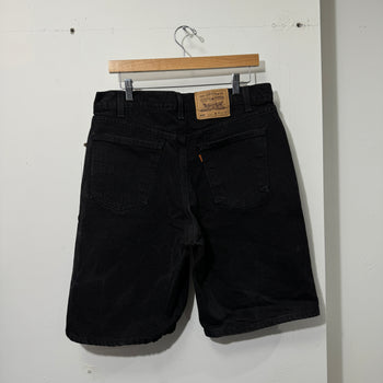 1990S LEVI’S 550 BAGGY BLACK FADED DENIM SHORTS