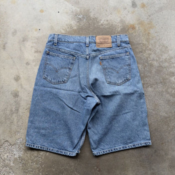 1990s LEVI’S 550 ORANGE TAB LIGHT WASH BAGGY DENIM JEAN SHORTS JORTS