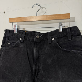 1990S LEVI’S 550 BAGGY BLACK FADED DENIM SHORTS