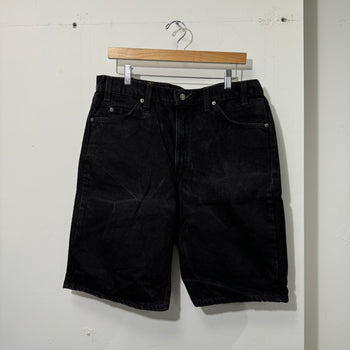 1990S LEVI’S 550 BAGGY BLACK FADED DENIM SHORTS