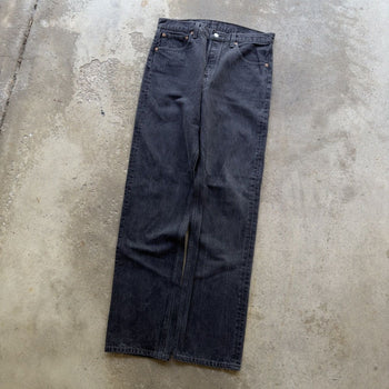 1990s LEVI’S 501 BLACK FADED DENIM JEANS MADE IN USA