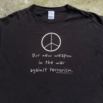 2000S OUR NEW WEAPON IS THE WAR AGAINST TERROISM PEACE TEE