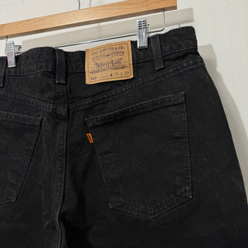 1990S LEVI’S 550 BAGGY BLACK FADED DENIM SHORTS