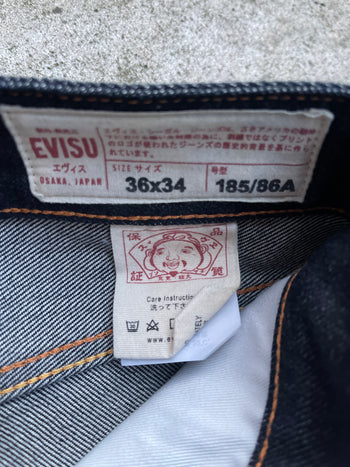 EVISU 2010 MULTI POCKET EMBROIDERED FACES SELVEDGE DENIM JEANS