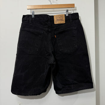 1990S LEVI’S 550 BAGGY BLACK FADED DENIM SHORTS