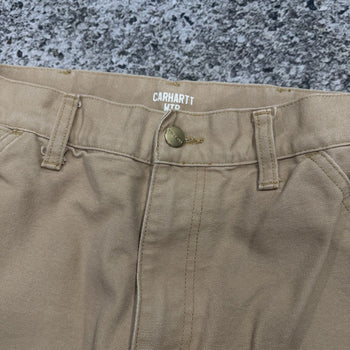 Pantalones de carpintero Carhartt WIP color tostado con doble rodilla
