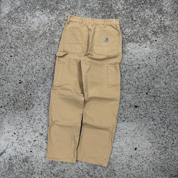 Pantalones de carpintero Carhartt WIP color tostado con doble rodilla
