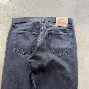 1990s LEVI’S 501 BLACK FADED DENIM JEANS MADE IN USA