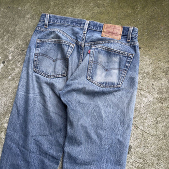 1990s LEVI'S 501XX MADE IN USA FADED THRASHED DENIM JEANS