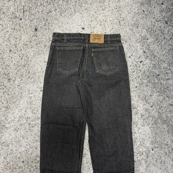 1990s Levi’s 550 Orange Tab Faded Black Denim Jeans