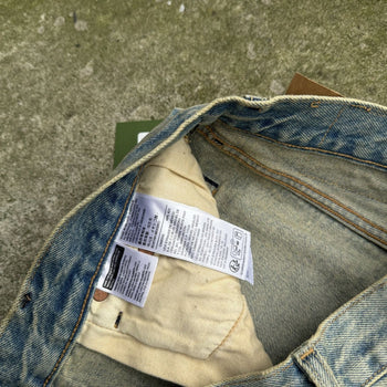 DENIM TEARS LEVI’S 501 DIRTY WASH DENIM JEANS