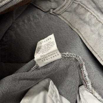 Vaqueros cónicos Levi's 560 de color gris descolorido de los años 90
