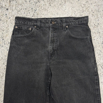 Vaqueros cónicos relajados Levi's 550 Faded Black de los años 90